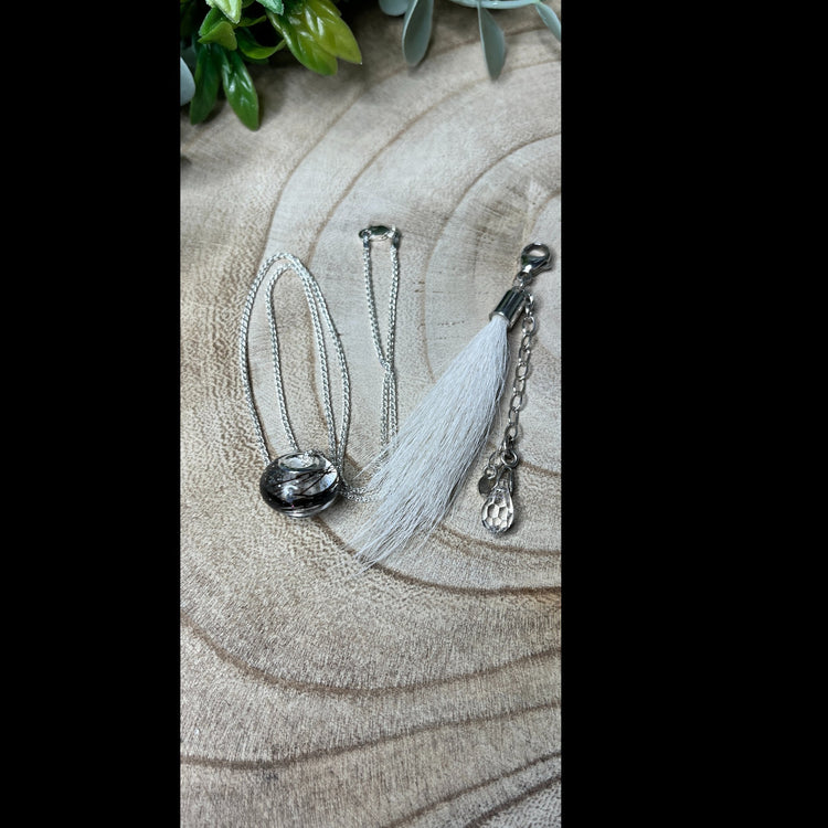 Donkey hair tassel with sterling silver clasp and charm