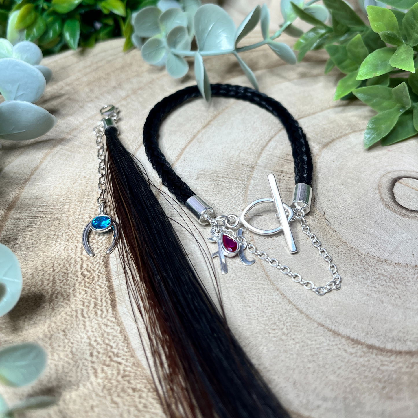 Bracelet with charms on and tassel and charms