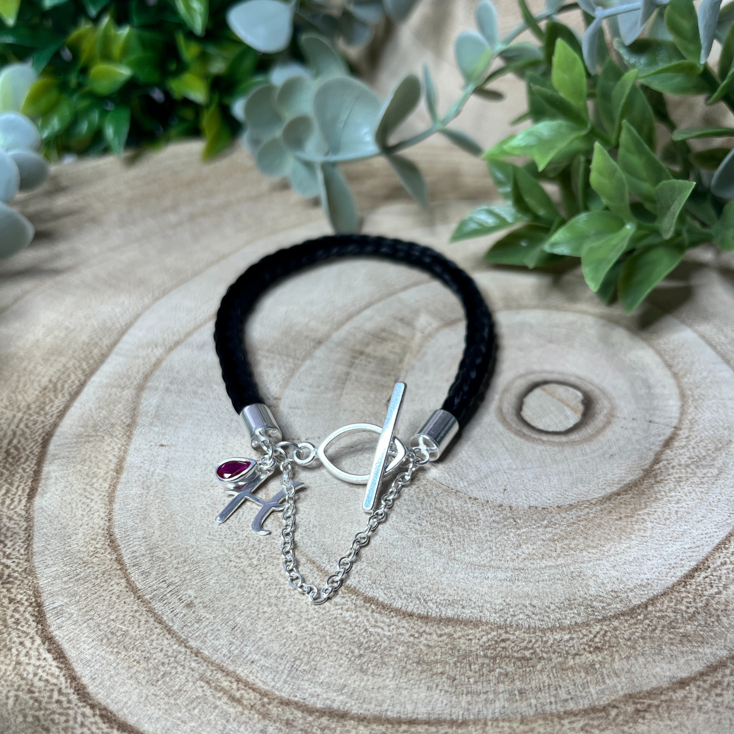 Horse hair bracelet with sterling silver fittings and charms