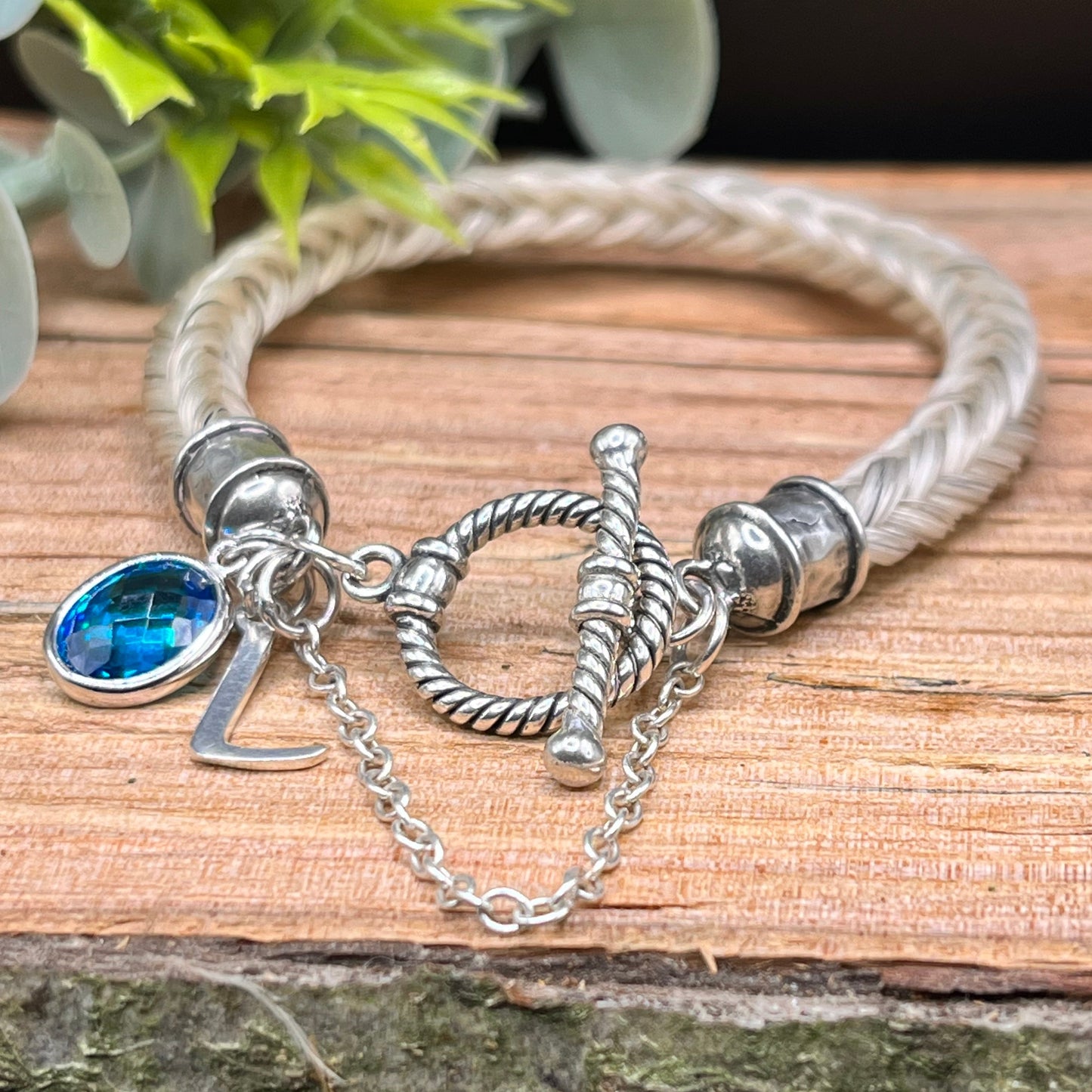 Braided horsehair bracelet with sterling silver end caps and safety chain