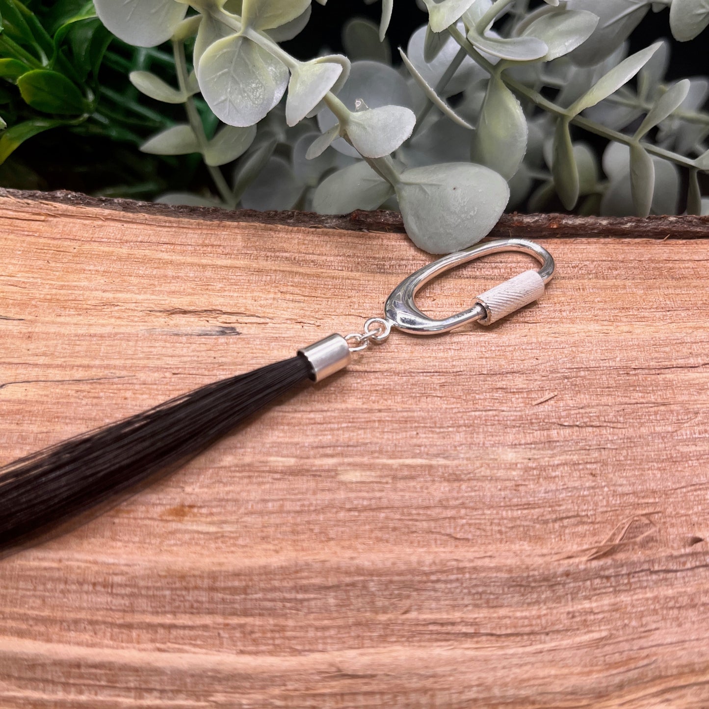 Loose horsehair tassel keepsake with polished sterling silver cap, oval screw